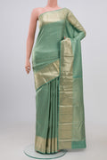 Light Green Kanchipuram Silk Saree with Zari Brocade on the body and Zari Border.  displayed on a mannequin