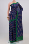 Blue Printed Silk Saree with Printed design on the body and Plain Border.  displayed on a mannequin