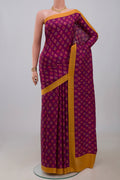 Purple Printed Silk Saree with Printed design on the body and Plain Border.  displayed on a mannequin