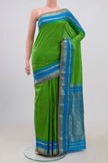 Green Narayanpet Silk Saree with Zari Butta on the body and Zari Border.  displayed on a mannequin