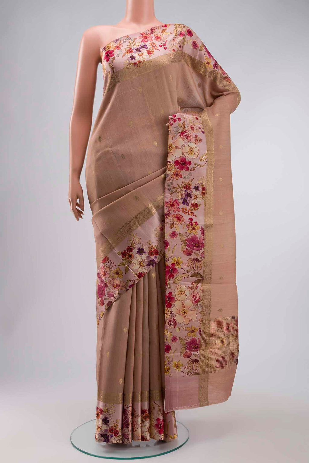 Peach Tussar Silk Saree with Zari Butta on the body and Printed Border displayed on a mannequin