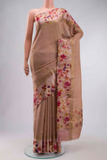 Peach Tussar Silk Saree with Zari Butta on the body and Printed Border displayed on a mannequin