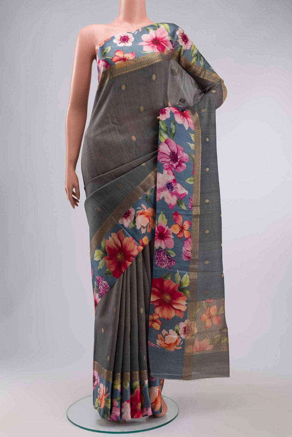 Grey Tussar Silk Saree with Zari Butta on the body and Printed Border displayed on a mannequin