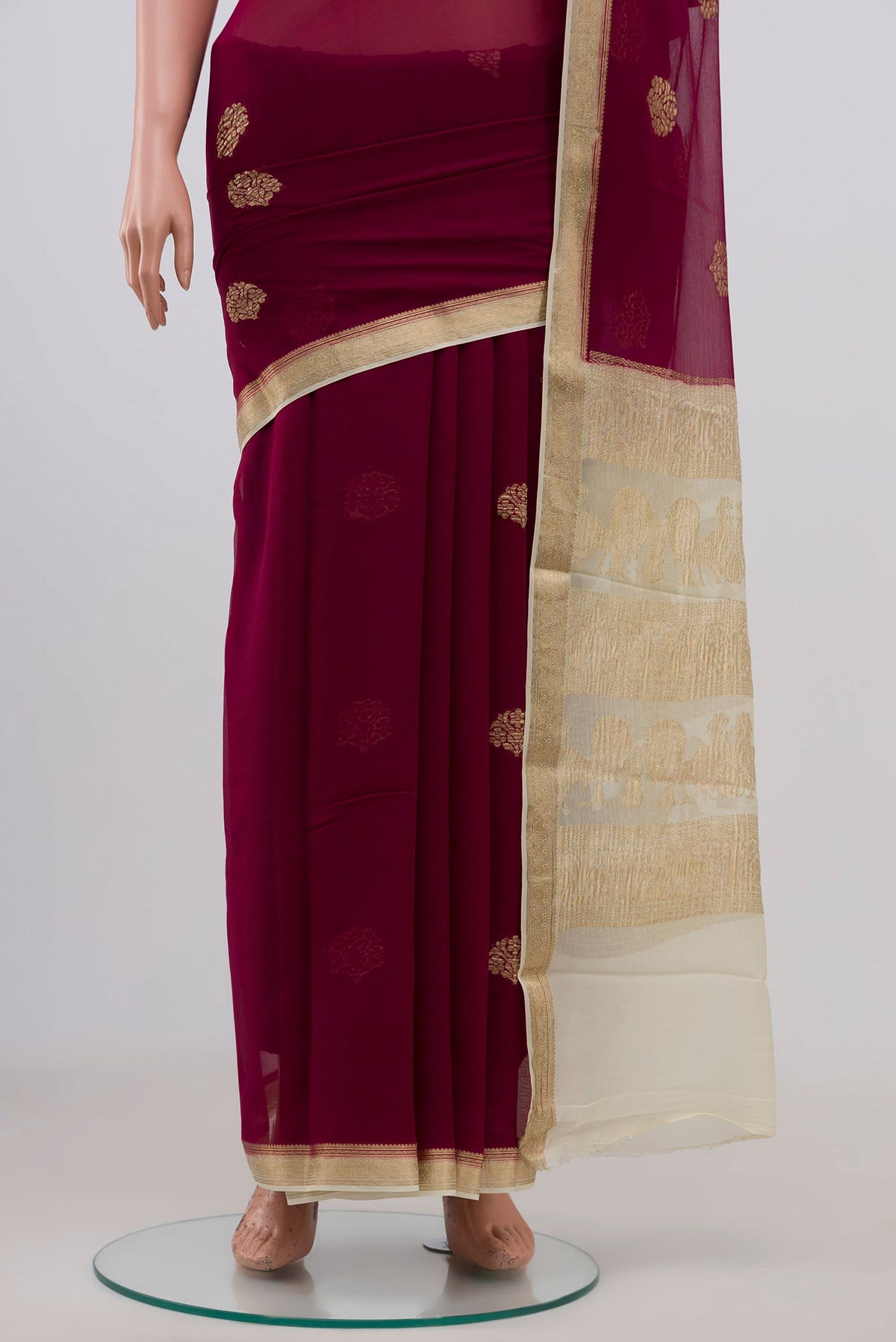 Pleats and pallu of Purple Chiffon Saree with Zari Butta on the body and Zari Border. 