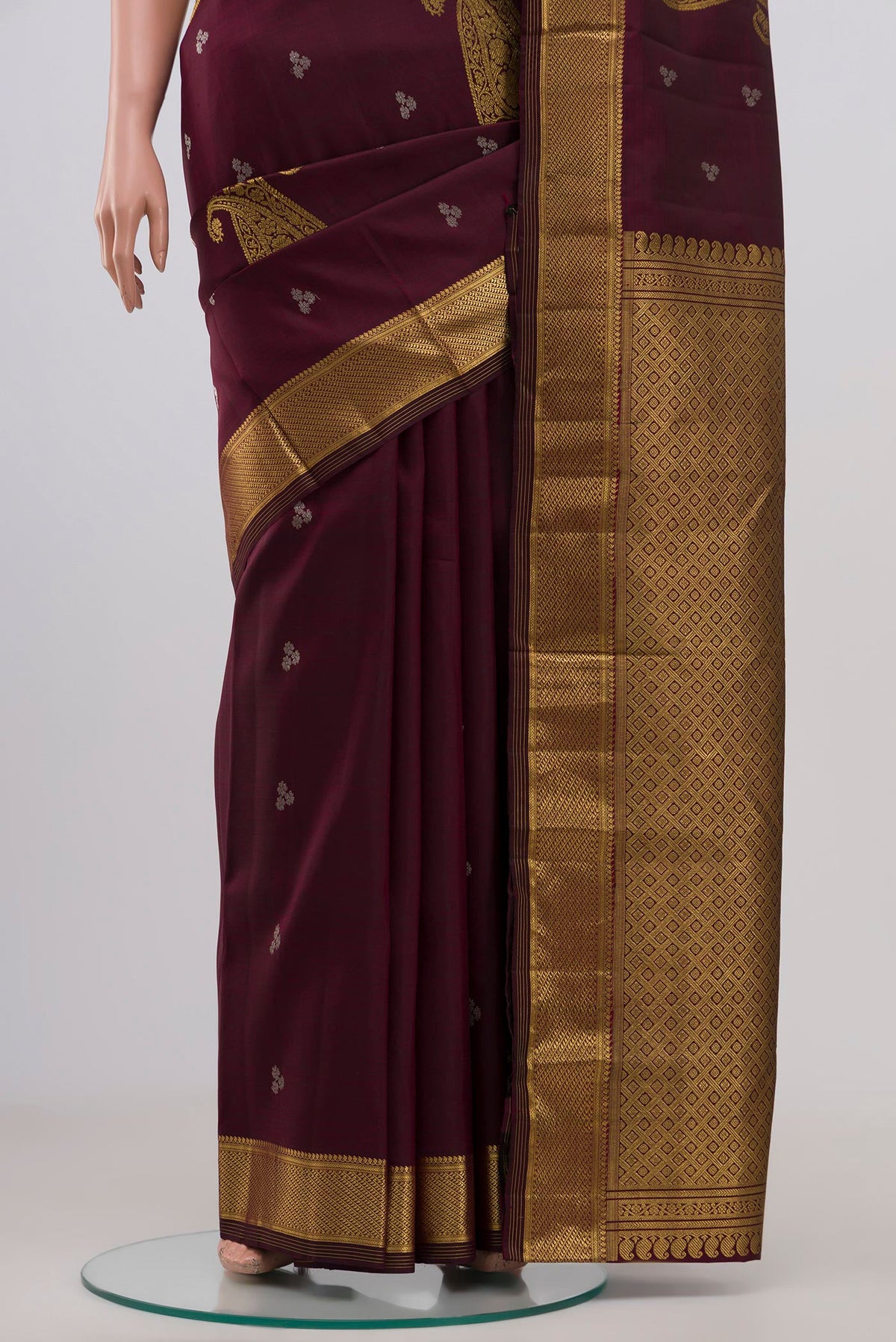 Pleats and pallu of Brown Kanjivaram Silk Saree with Zari Butta on the body and Zari Border. 