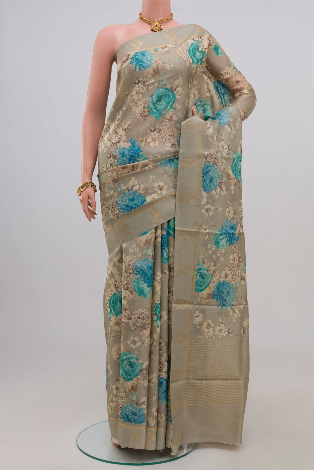 Green Tussar Silk Saree with Fancy on the body and Thin Zari Line.  displayed on a mannequin