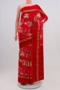 Red Printed Silk Saree with Printed design on the body and Zari Border.  displayed on a mannequin