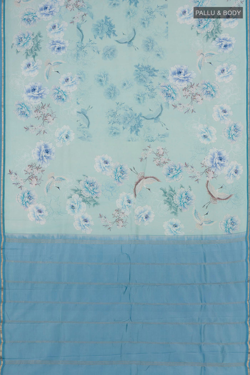 Flat view of Sky Blue Printed Silk Saree with Floral Print on the body and Zari Border. 