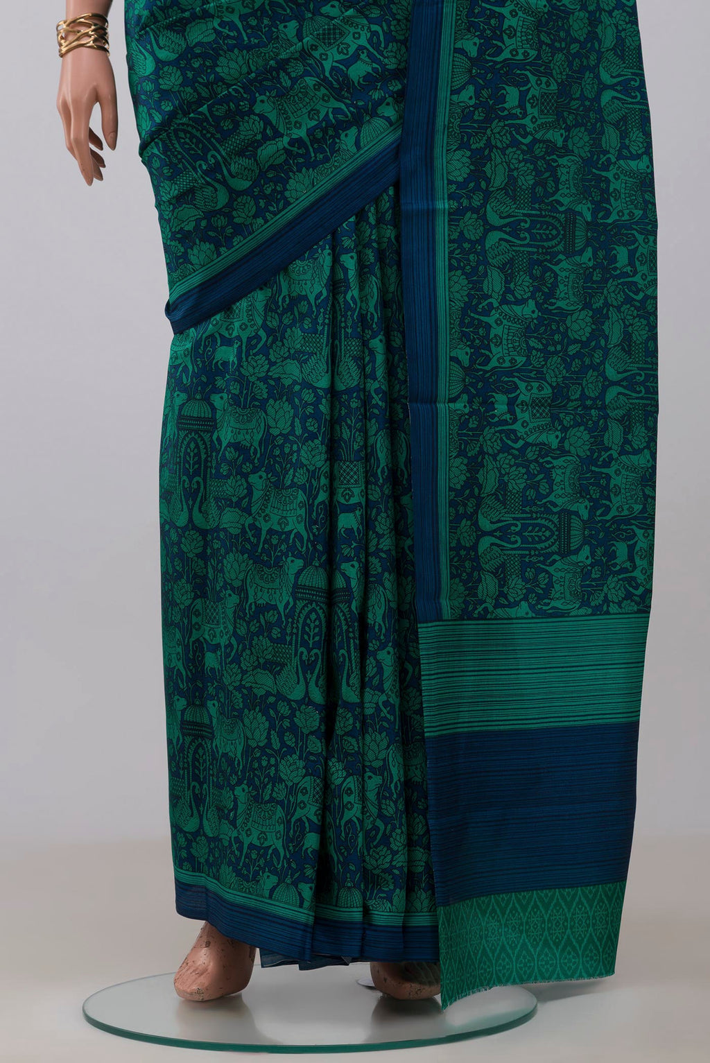 Pleats and pallu of Navy Blue Printed Silk Saree with Printed design on the body and Plain Border. 