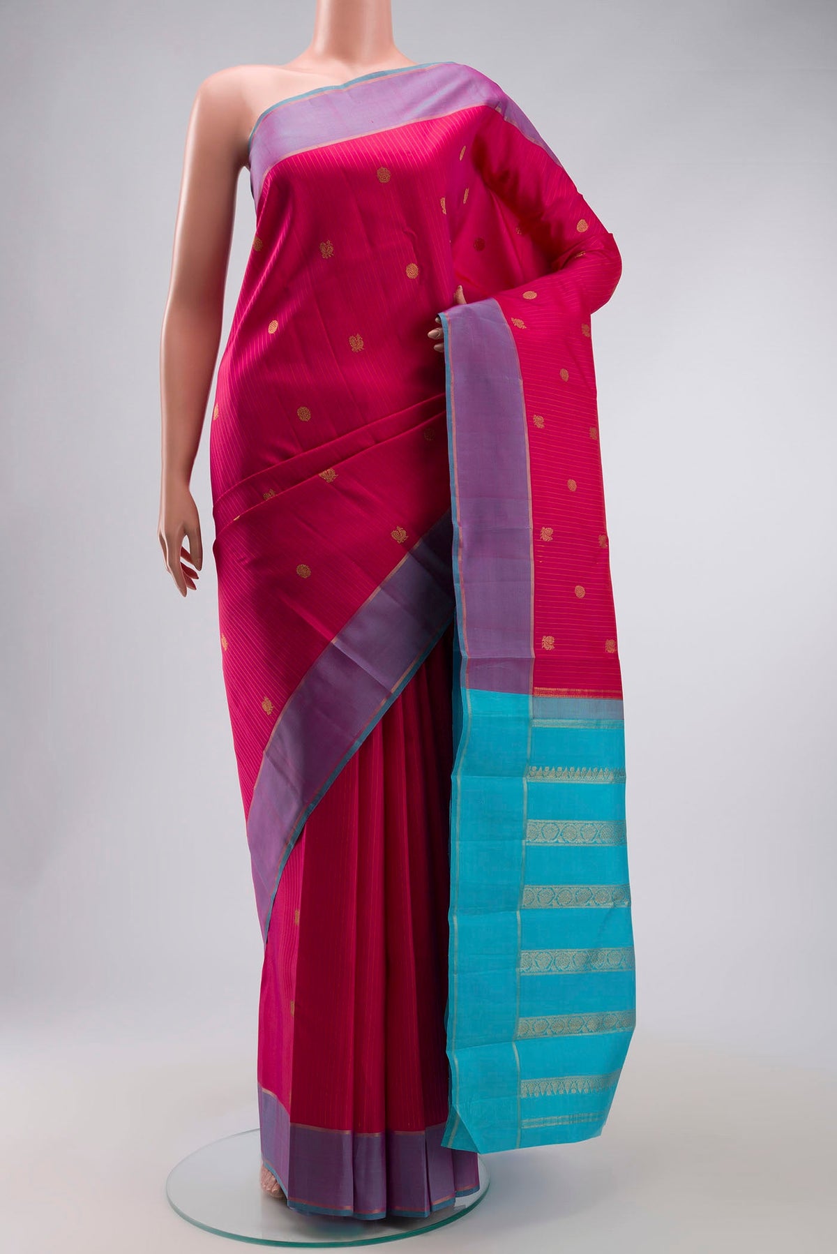 Pink Kanchipuram Silk Saree with Stripes on the body and Zari Border displayed on a mannequin