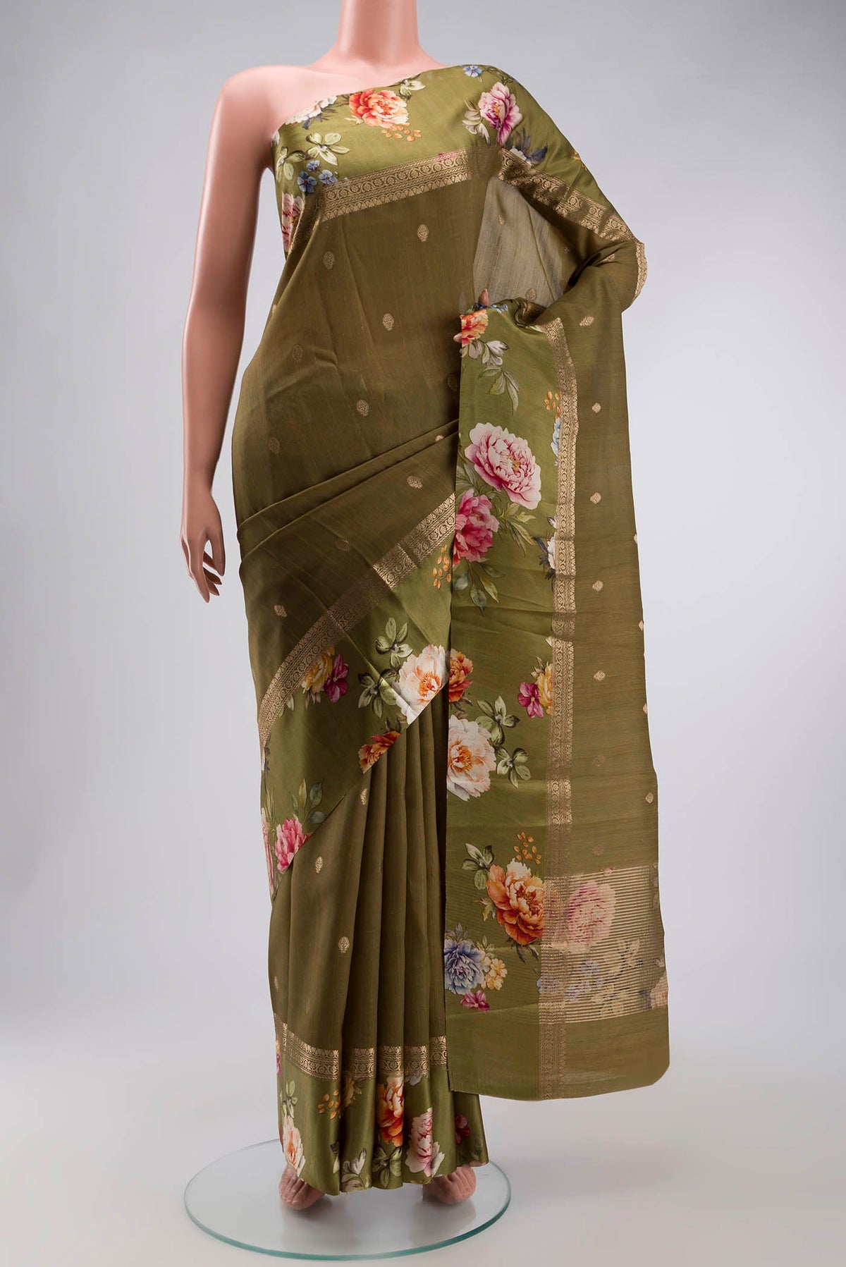 Green Tussar Silk Saree with Zari Butta on the body and Printed Border displayed on a mannequin