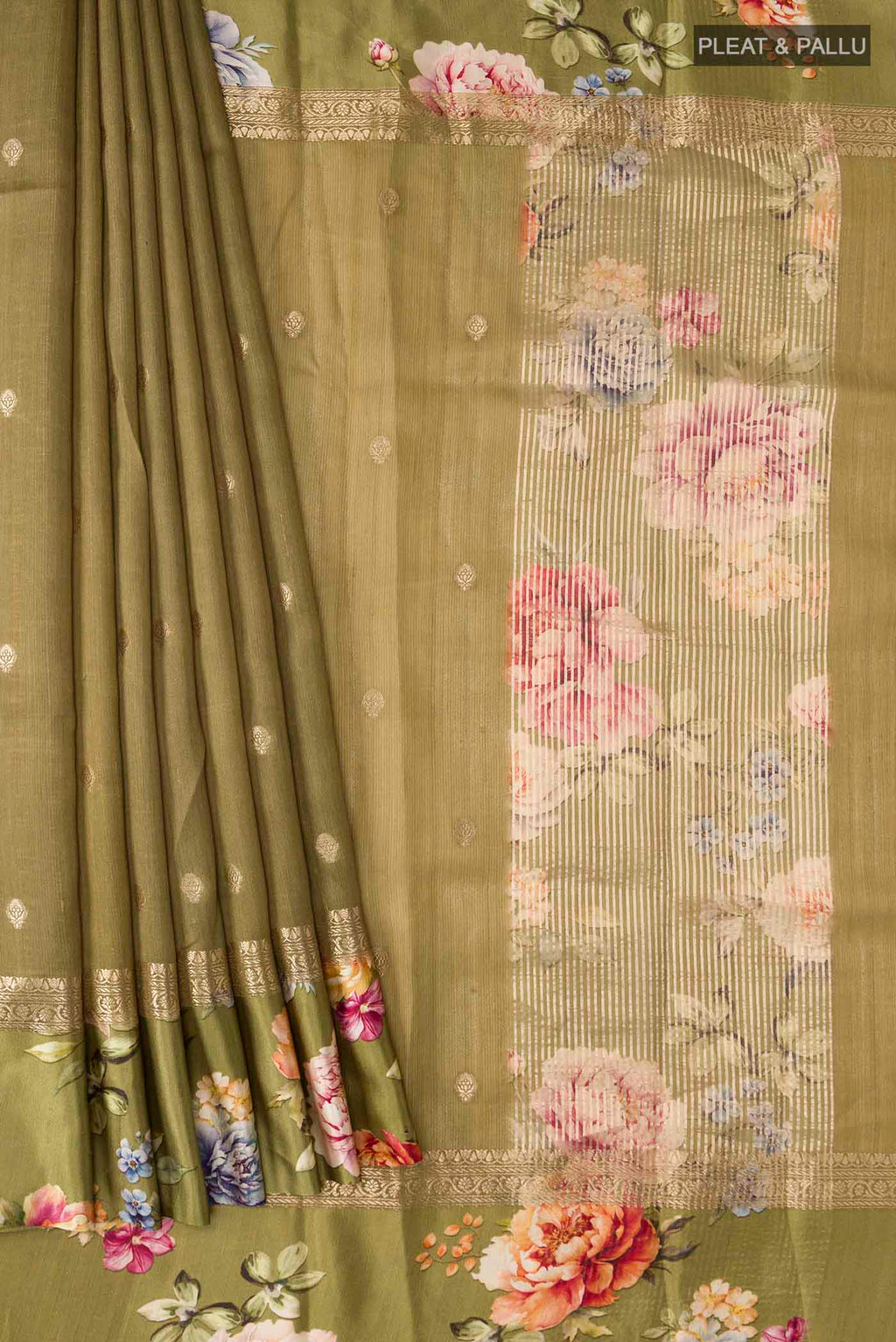 Pleats and pallu of Green Tussar Silk Saree with Zari Butta on the body and Printed Border
