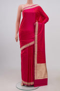 Pink Banarasi Silk Saree with Jacquard design on the body and Zari Border.  displayed on a mannequin