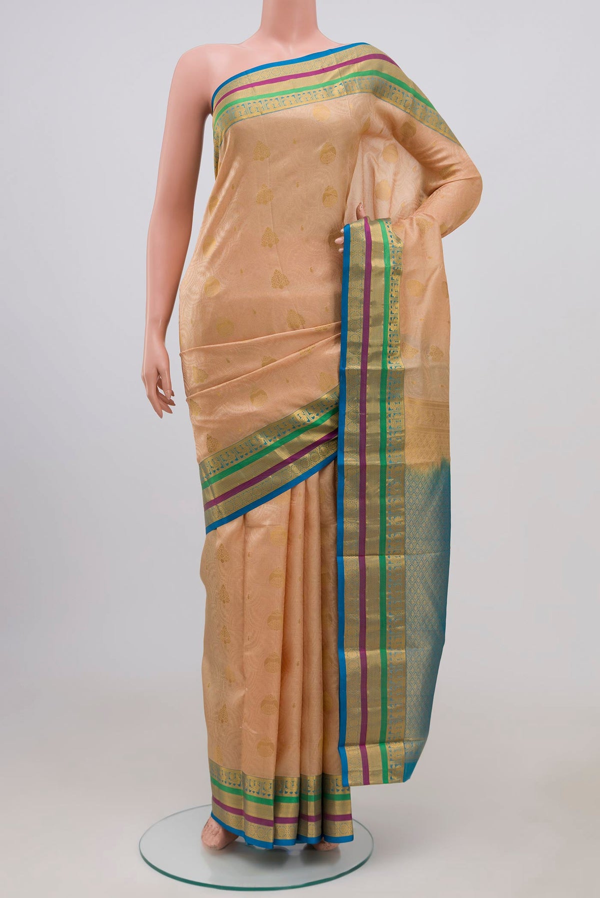 Cream Kanchipuram Silk Saree with Jacquard design on the body and Zari Border.  displayed on a mannequin