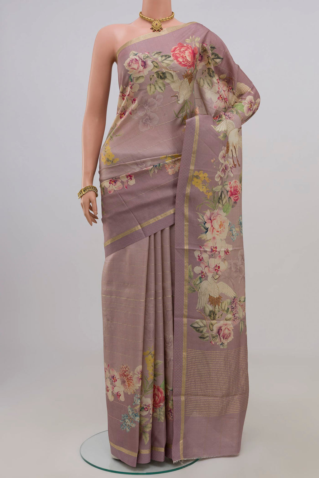 Lavender Tussar Silk Saree with Fancy on the body and Thin Zari Line.  displayed on a mannequin