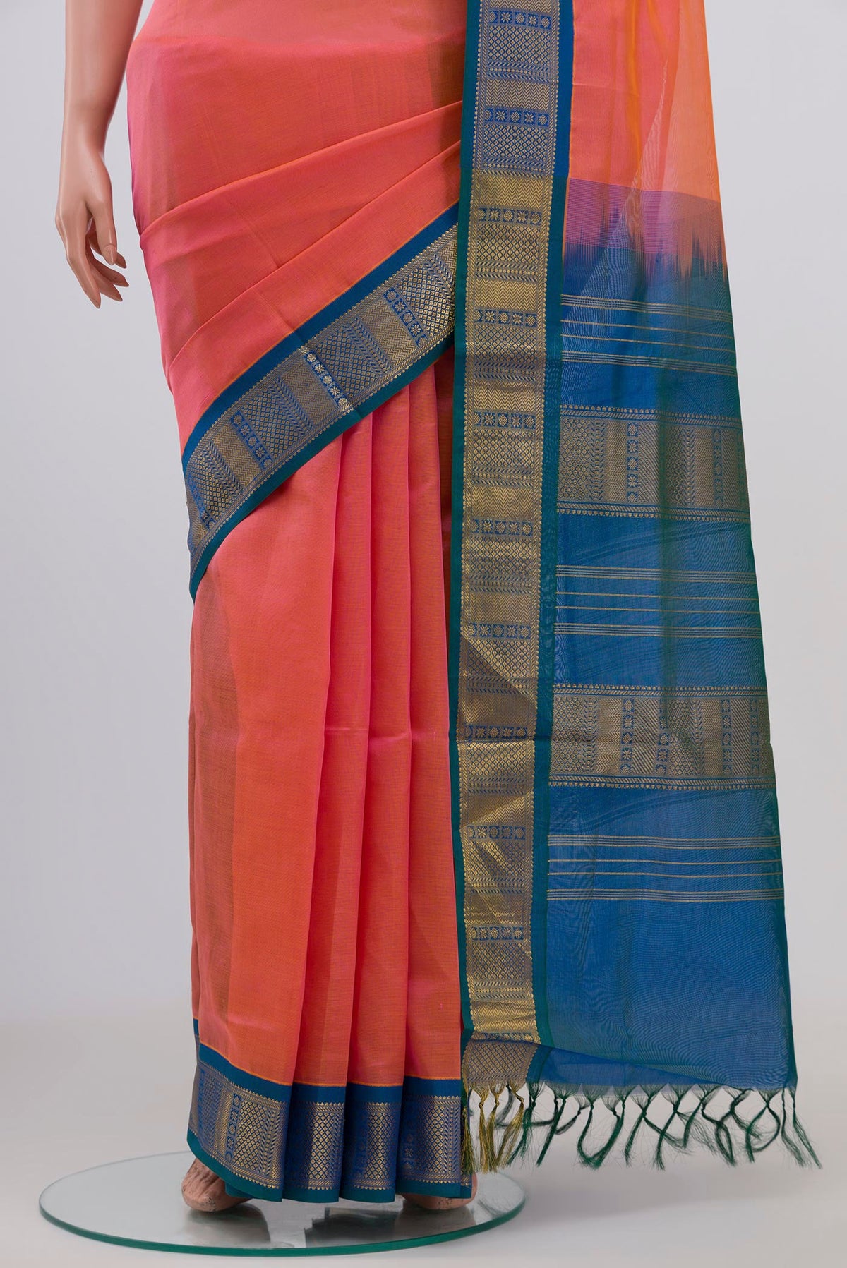 Pleats and pallu of Peach Silk Cotton Saree with Plain Body and Zari Border. 