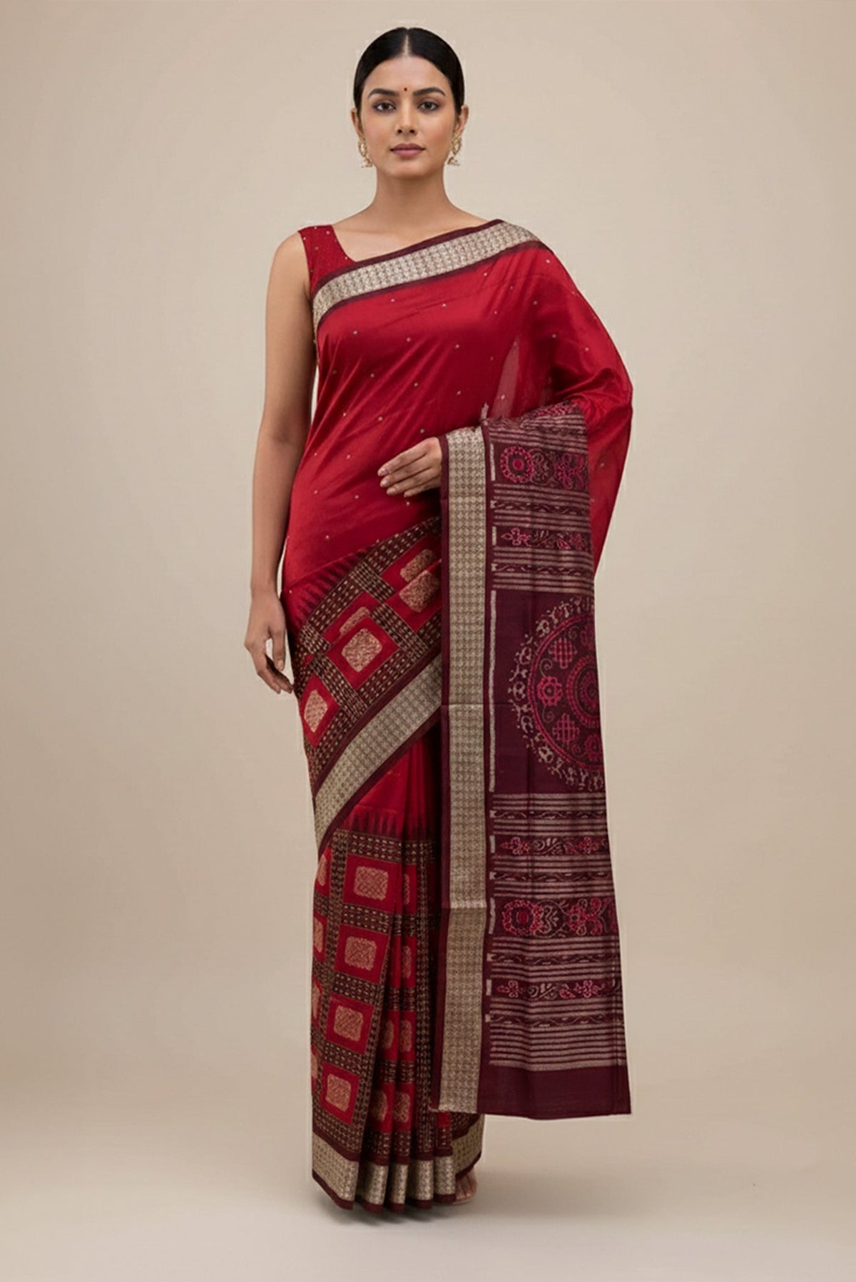 Model wearing a Maroon Orissa Silk Saree with Thread Butta on the body and Thread Border