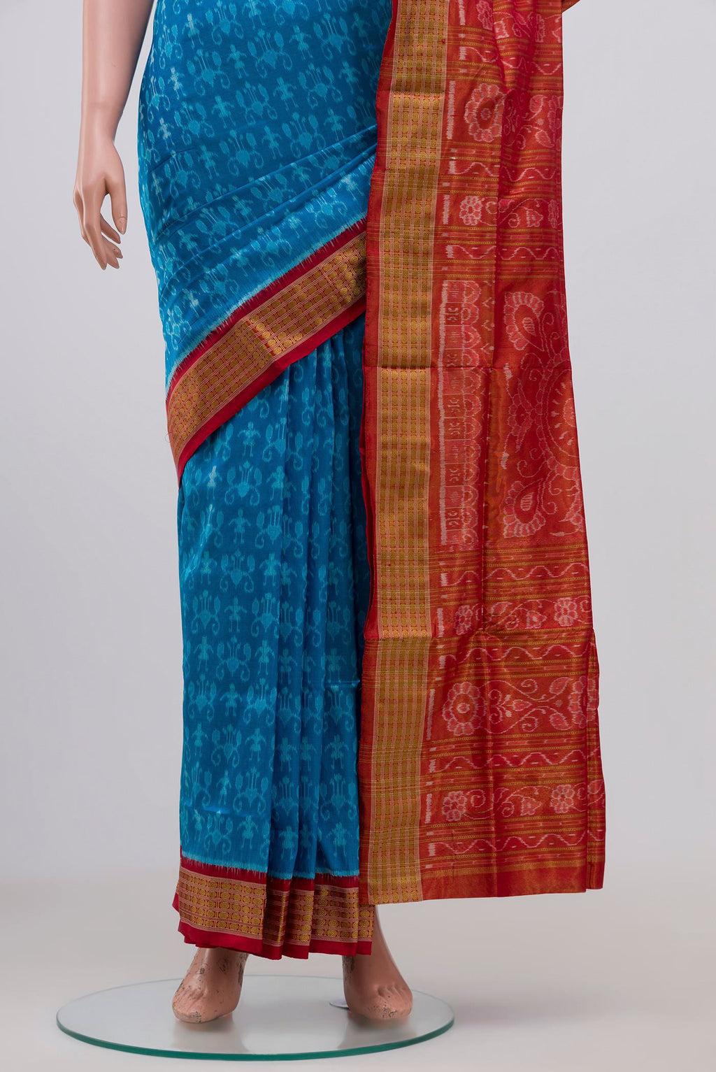 Pleats and pallu of Blue Orissa Silk Saree with Ikat Print on the body and Zari Border. 