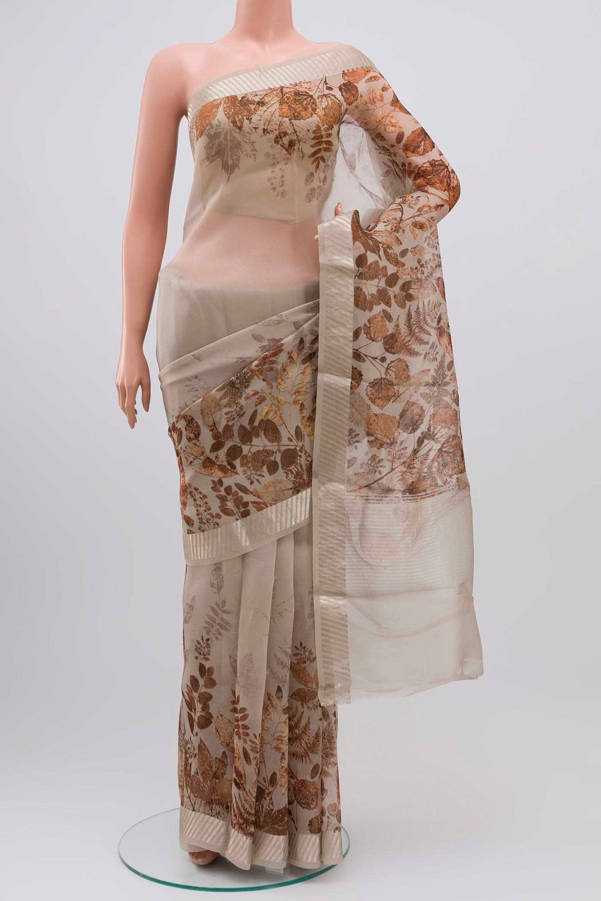 Grey Organza Silk Saree with Floral Print on the body and Zari Border displayed on a mannequin