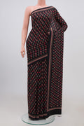 Black Crepe Saree with Printed design on the body and Plain Border.  displayed on a mannequin
