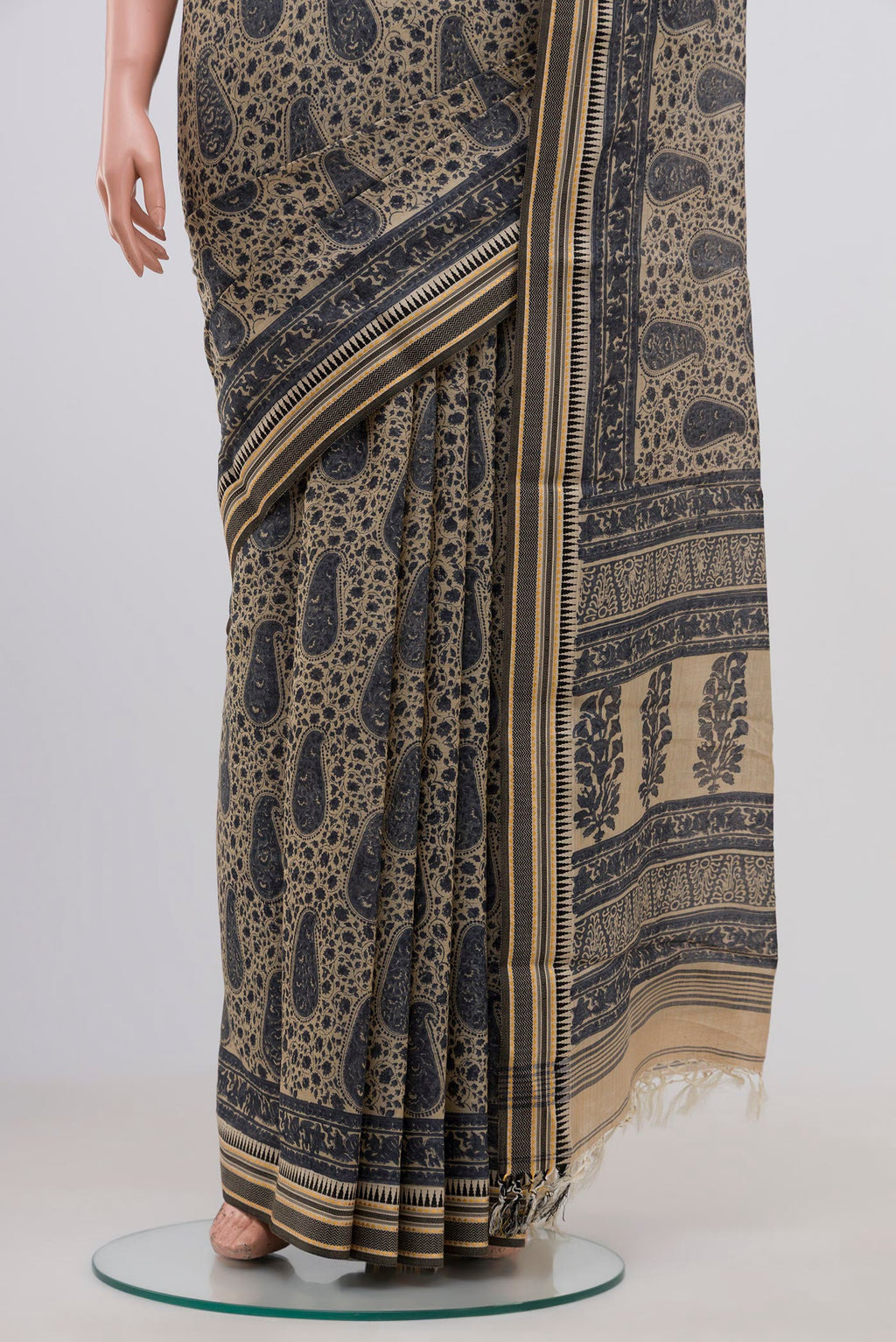 Pleats and pallu of Beige Tussar Saree with Floral Print on the body and Thread Border. 