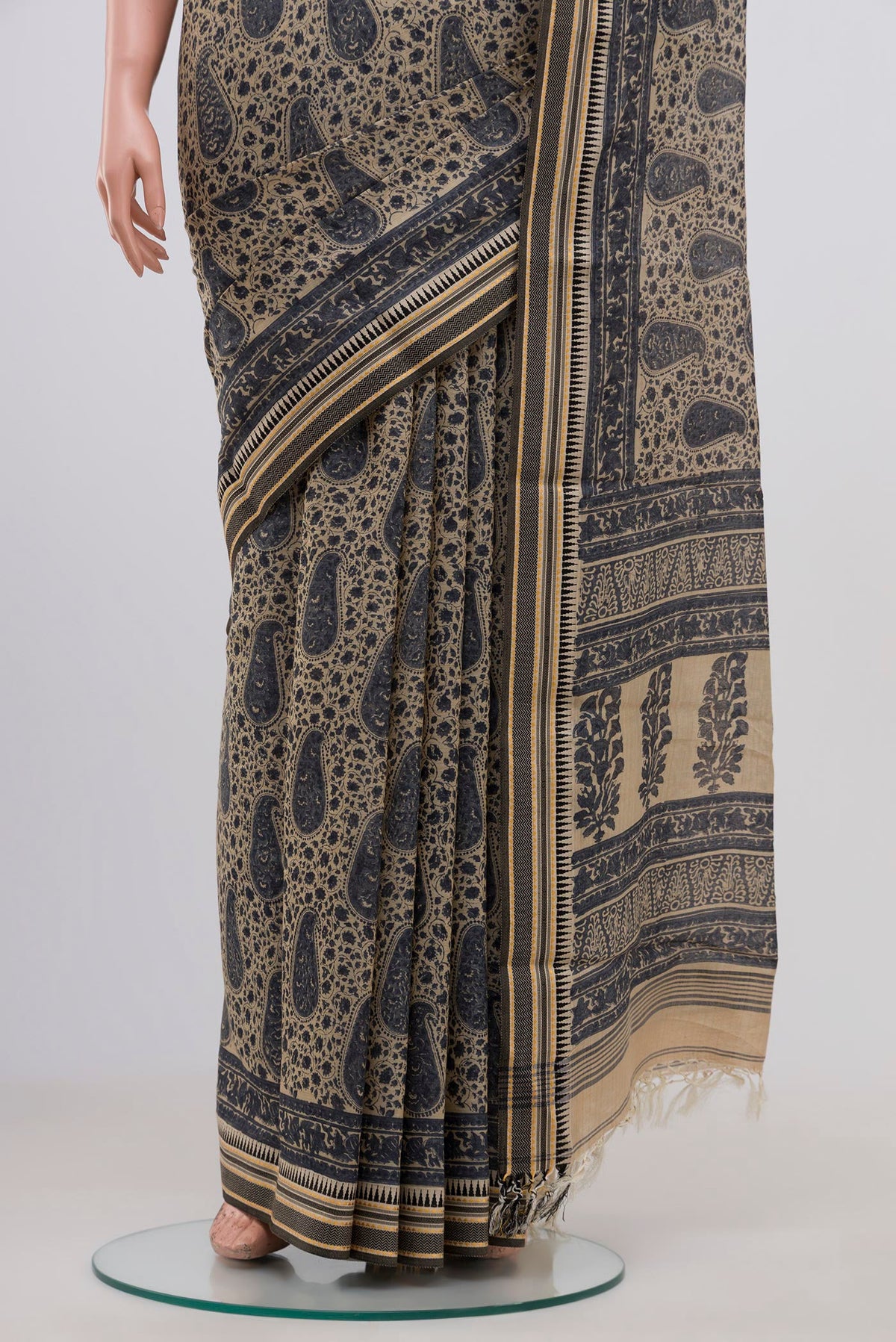 Pleats and pallu of Beige Tussar Saree with Floral Print on the body and Thread Border. 