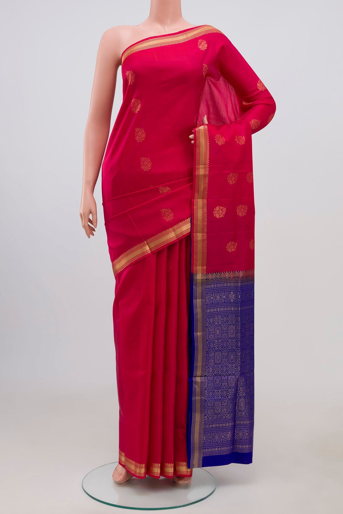 Pink Soft Silk Saree with Zari Butta on the body and Zari Border.  displayed on a mannequin