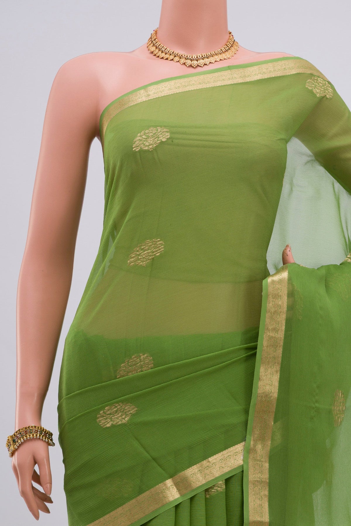 Border image of Green Chiffon Saree with Zari Butta on the body and Zari Border. 