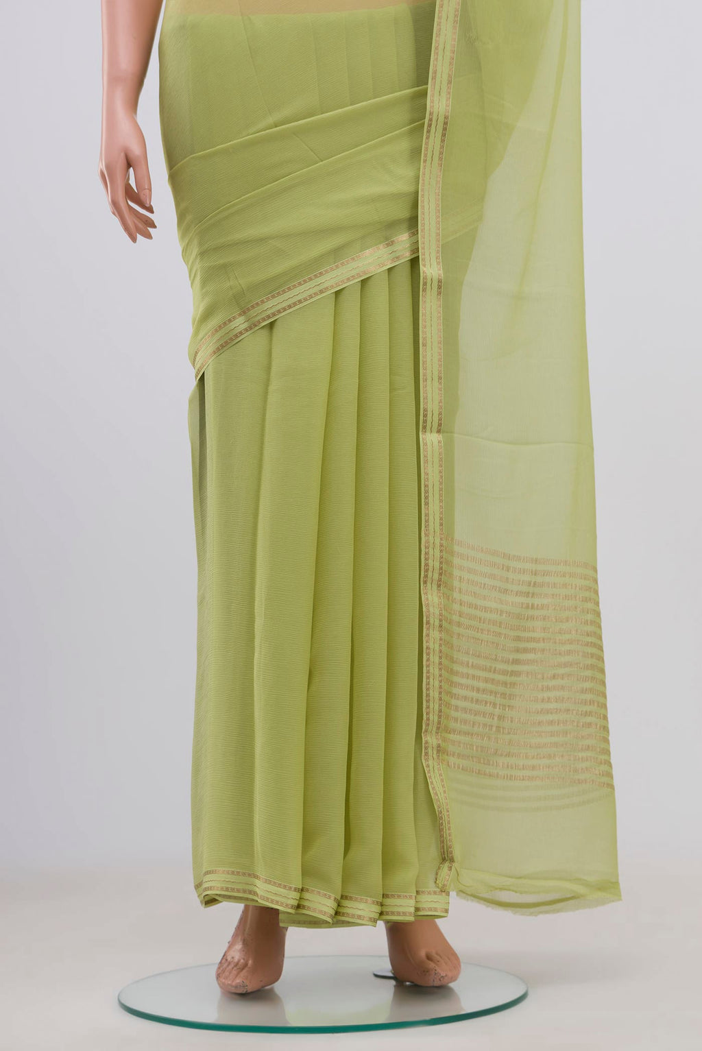 Pleats and pallu of Pista Green Chiffon Saree with Plain Body and Zari Border. 