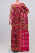 Pink Pochampally Silk Saree with Ikat Print on the body and Zari Border.  displayed on a mannequin
