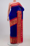 Blue Pochampally Silk Saree with Plain Body and Zari Border.  displayed on a mannequin