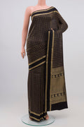 Black Crepe Saree with Zari Brocade on the body and Zari Border.  displayed on a mannequin