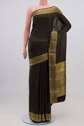 Black Crepe Saree with Zari Butta on the body and Zari Border.  displayed on a mannequin