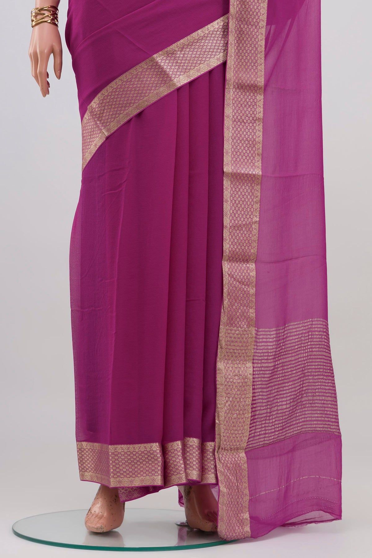 Pleats and pallu of Light Magenta Mysore Chiffon Saree with Plain Body and Zari Border. 