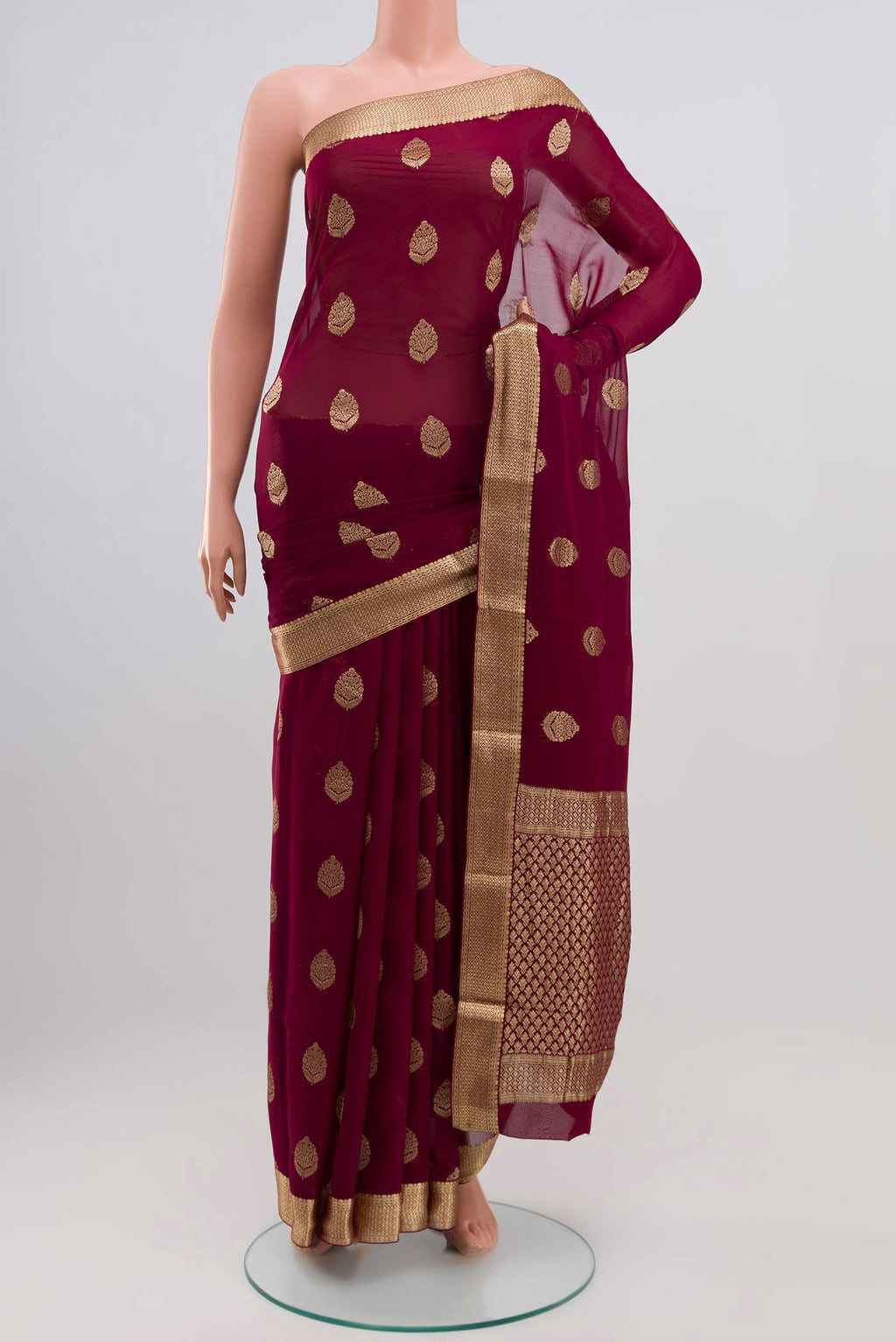 Purple Georgette Saree with Zari Butta on the body and Zari Border.  displayed on a mannequin