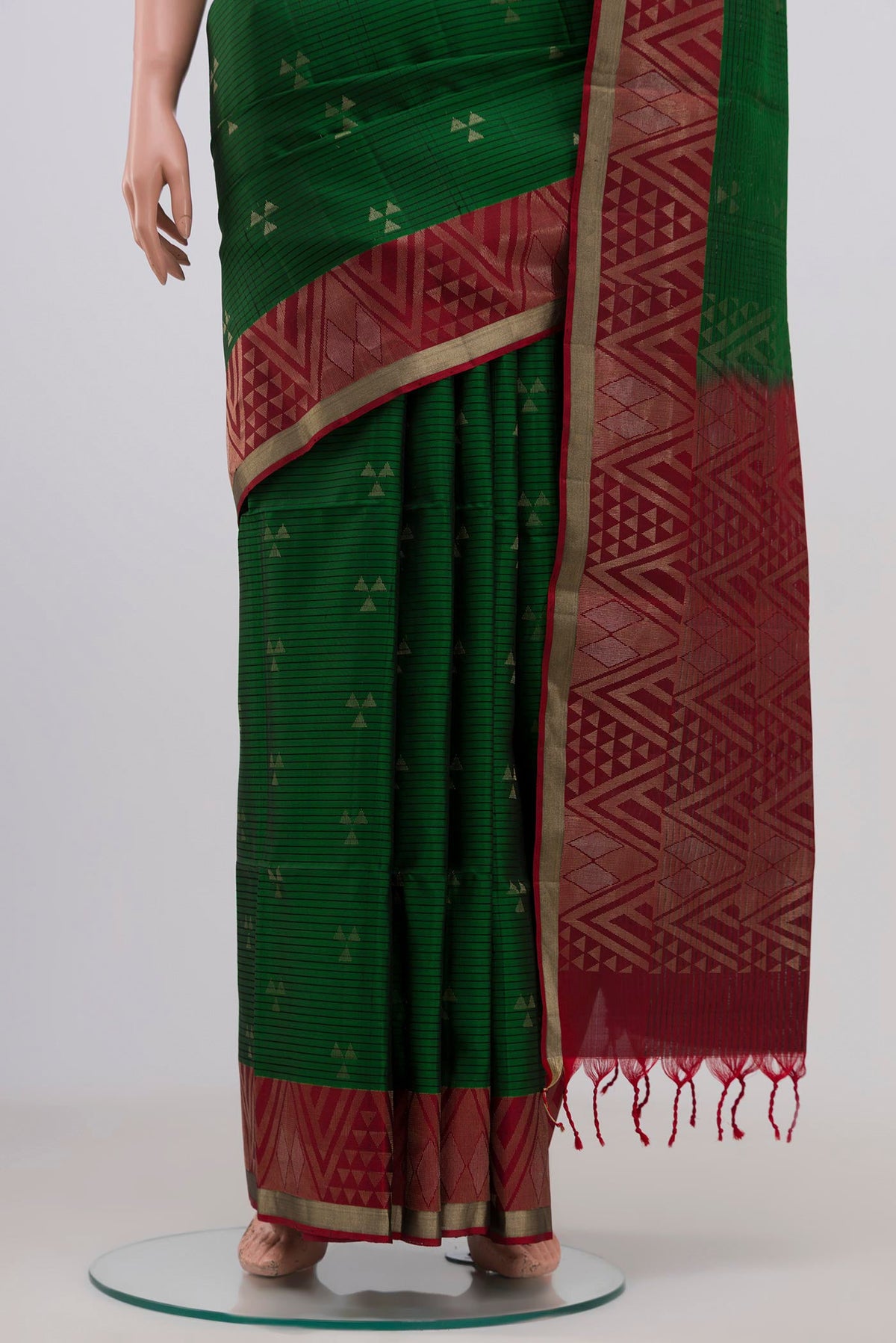 Pleats and pallu of Green Soft Silk Saree with Zari Butta on the body and Fancy Border. 