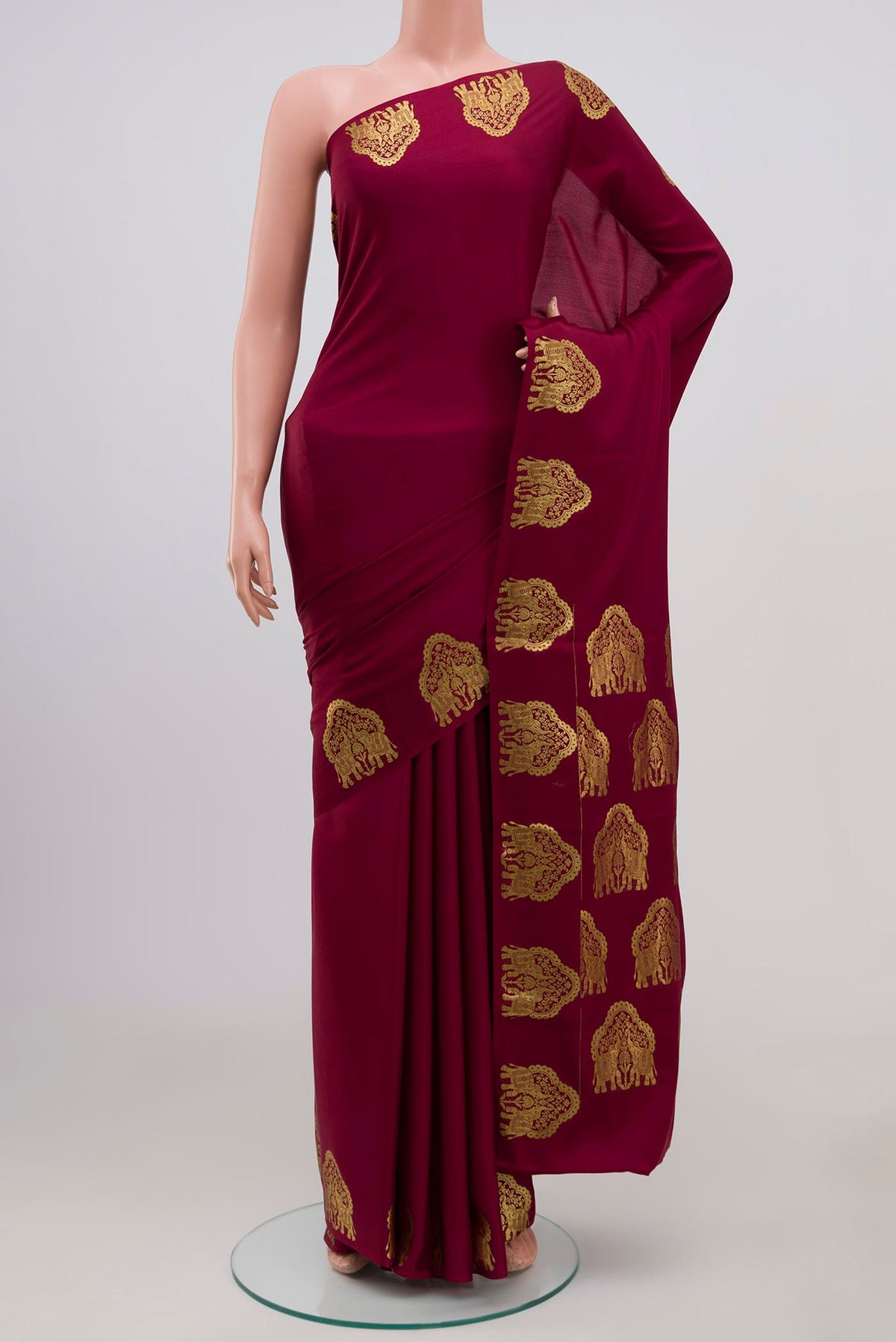 Maroon Mysore Crepe Saree with Plain Body and Fancy Border.  displayed on a mannequin