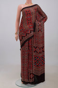 Maroon Blended Satin Silk Saree with Ajrakh Print on the body and Printed Border.  displayed on a mannequin