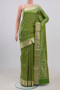 Green Soft Silk Saree with Zari Brocade on the body and Zari Border.  displayed on a mannequin