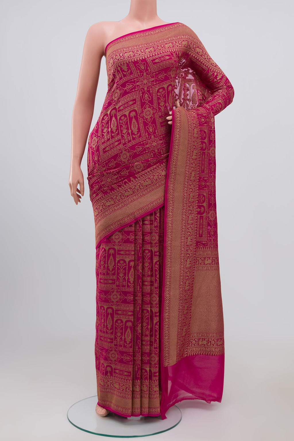 Pink Georgette Saree with Fancy on the body and Zari Border.  displayed on a mannequin