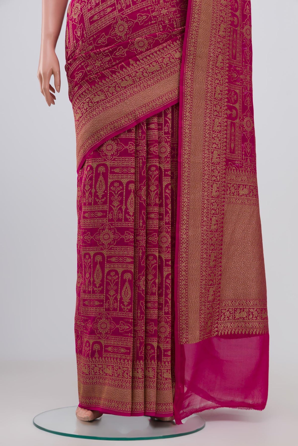 Pleats and pallu of Pink Georgette Saree with Fancy on the body and Zari Border. 