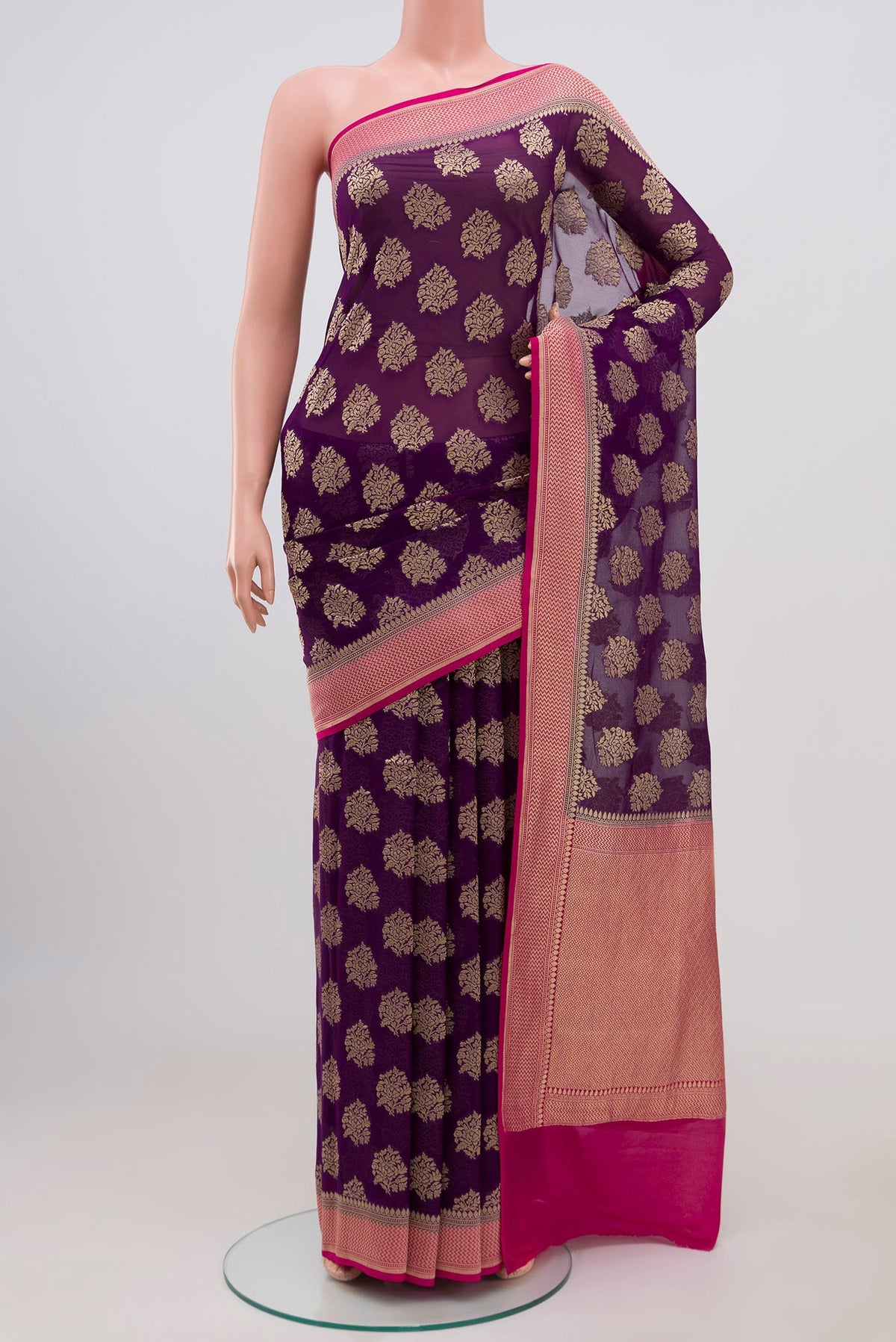 Purple Banarasi Georgette Saree with Fancy on the body and Zari Border.  displayed on a mannequin
