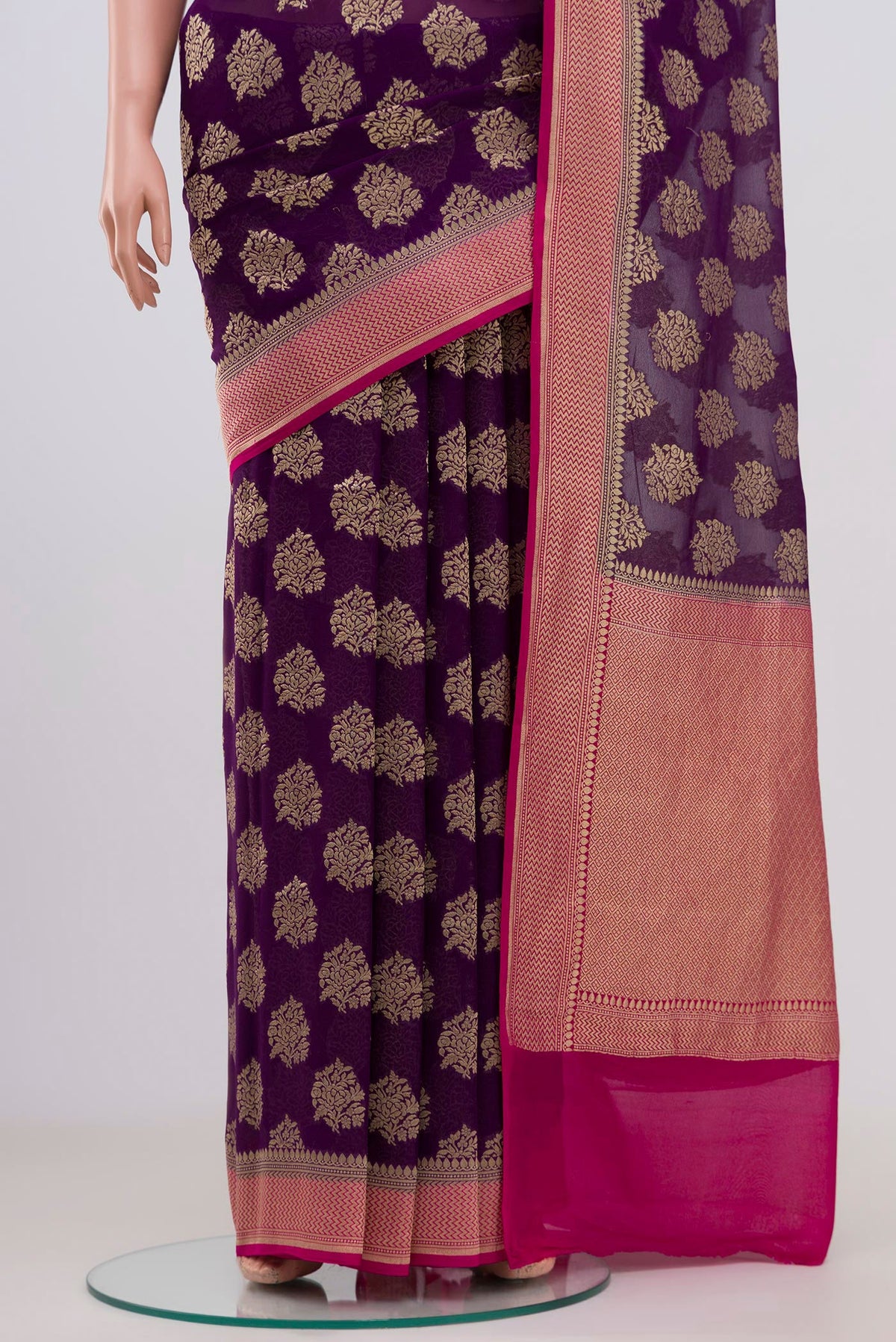 Pleats and pallu of Purple Banarasi Georgette Saree with Fancy on the body and Zari Border. 