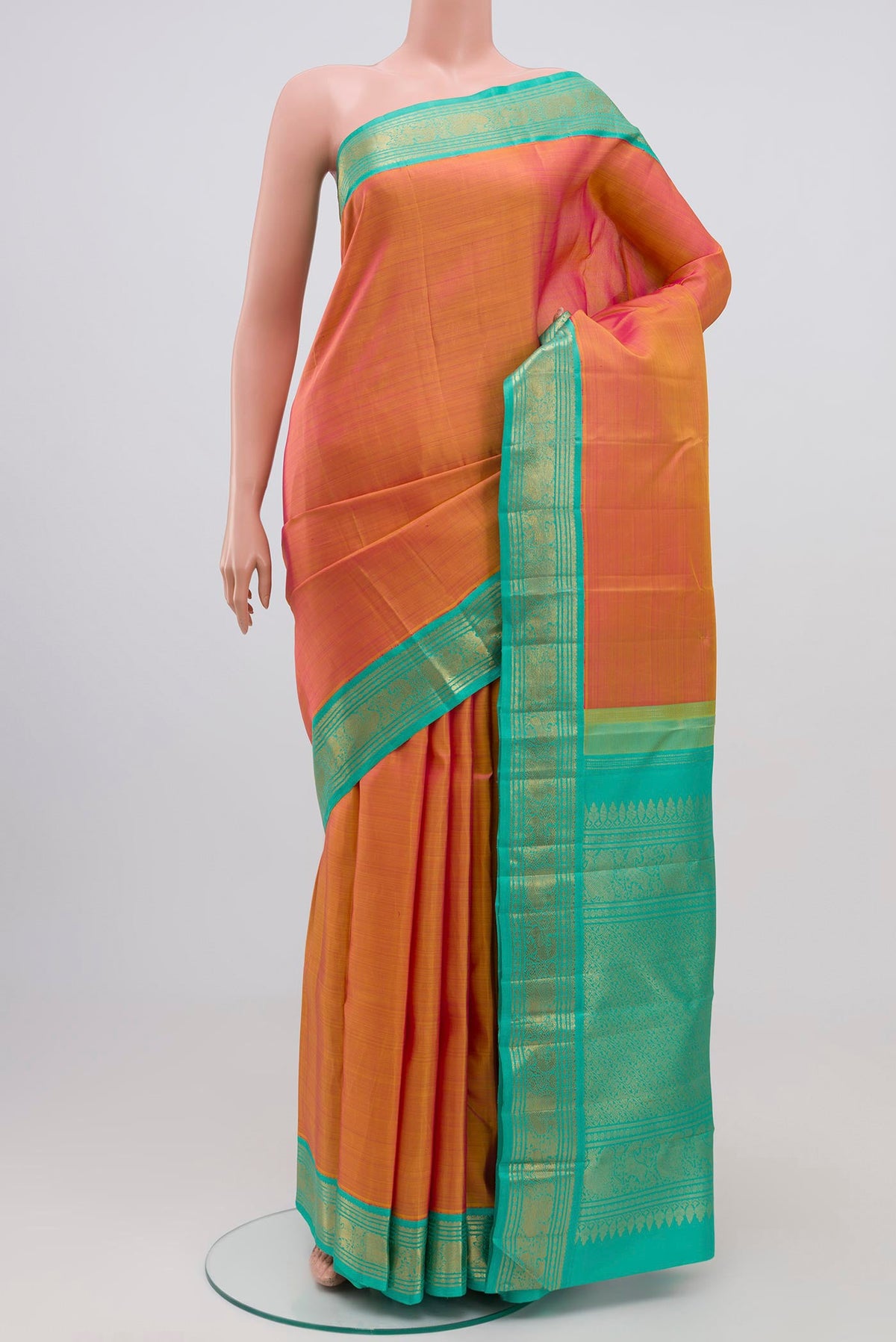 Pure Silk Pure Zari Orange Dual Tone Kanjivaram Saree with Plain Body and Zari Border.  displayed on a mannequin