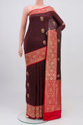 Maroon Banarasi Katan Silk Saree with Zari Butta on the body and Zari Border.  displayed on a mannequin