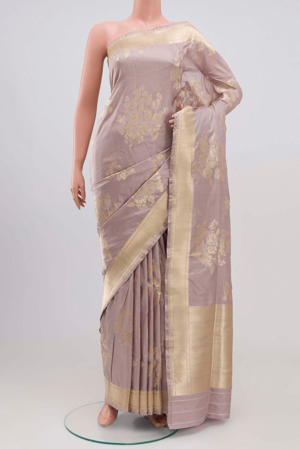 Lavender Banarasi Silk Saree with Zari Butta on the body and Zari Border.  displayed on a mannequin