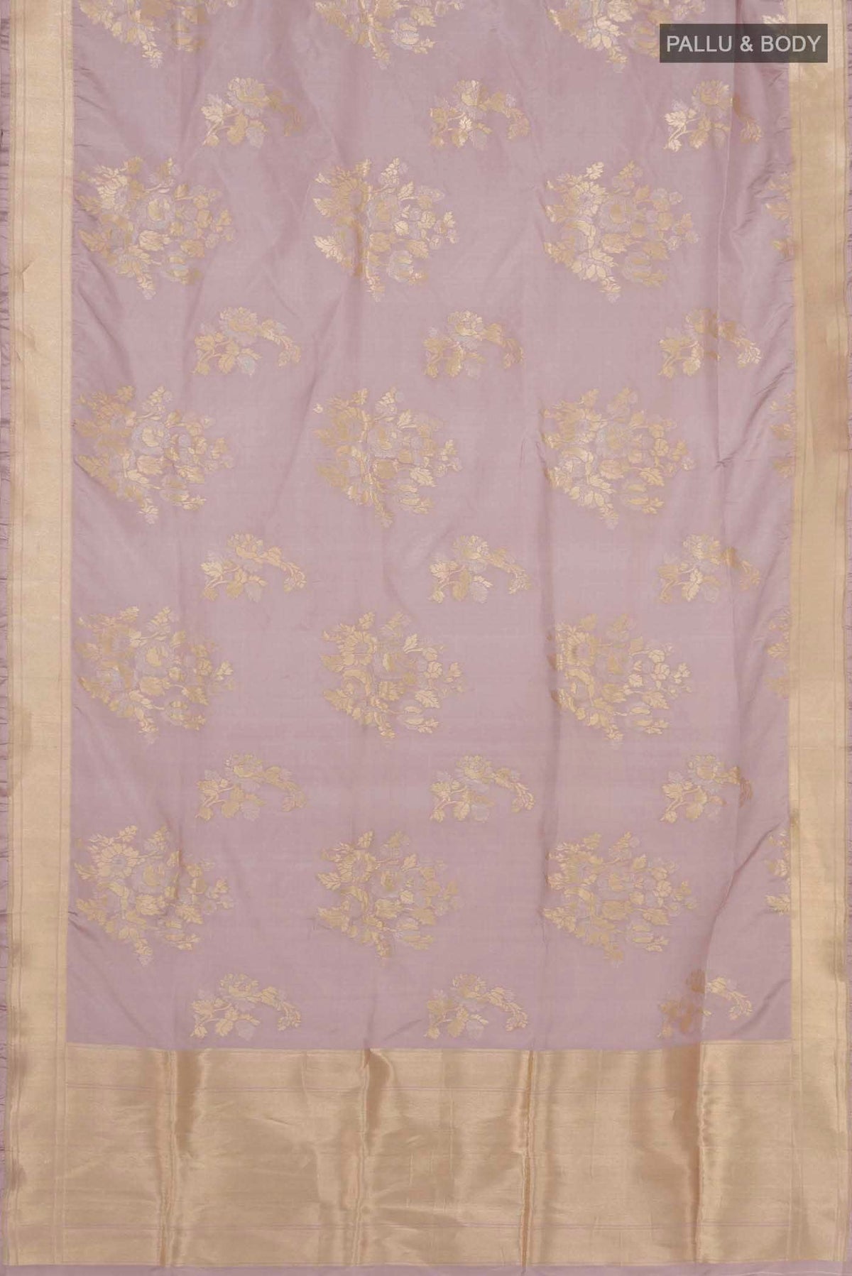 Flat view of Lavender Banarasi Silk Saree with Zari Butta on the body and Zari Border. 