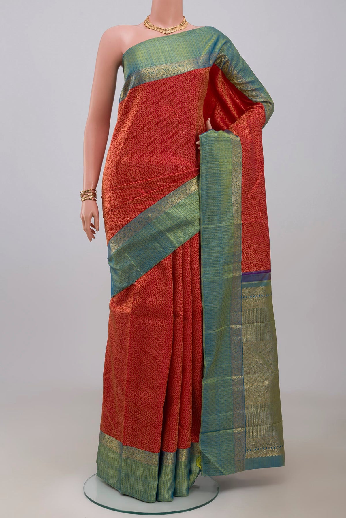 Pure Silk Pure Zari Red Kanchipuram Saree with Jacquard design on the body and Zari Border.  displayed on a mannequin