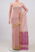 Peach Chanderi Silk Cotton Saree with Zari Butta on the body and Zari Border.  displayed on a mannequin