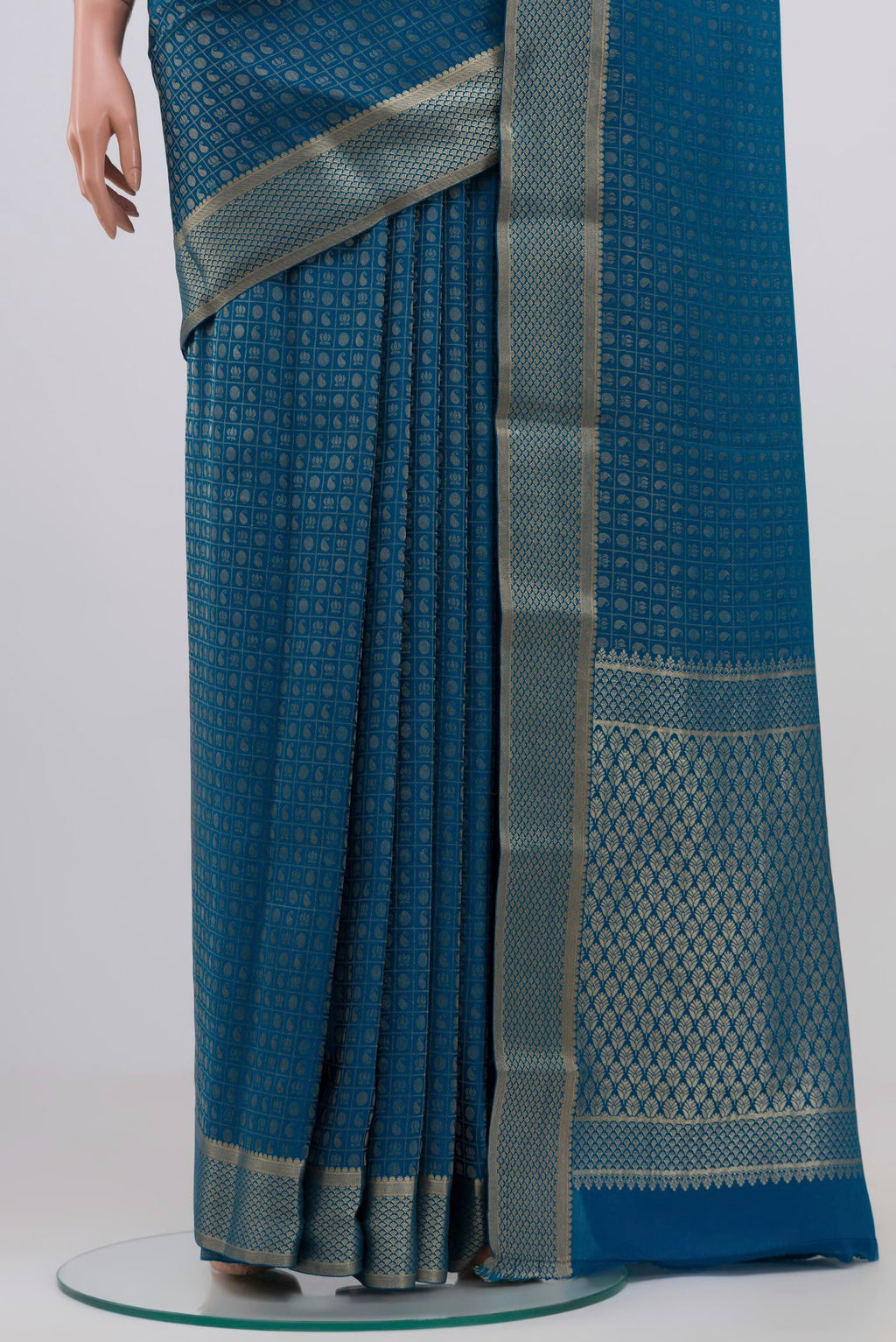 Pleats and pallu of Blue Grey Mysore Crepe Saree with Zari Butta on the body and Zari Border. 